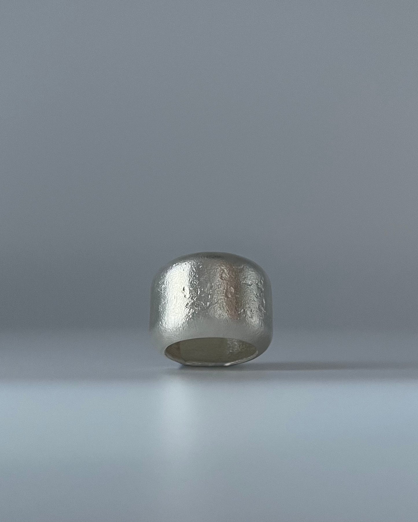 Kneeling Figure in Silver