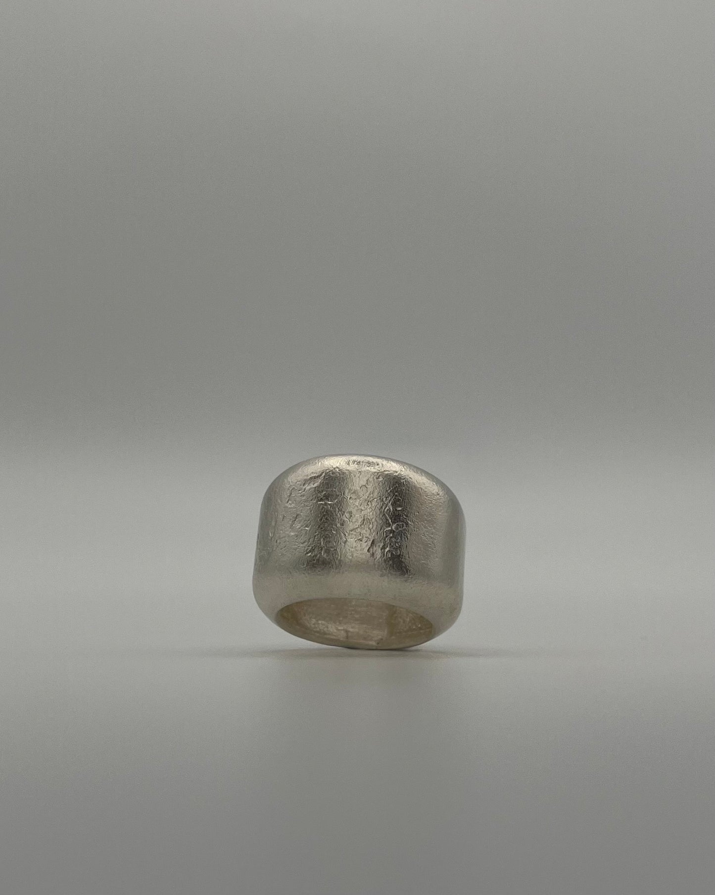 Kneeling Figure in Silver